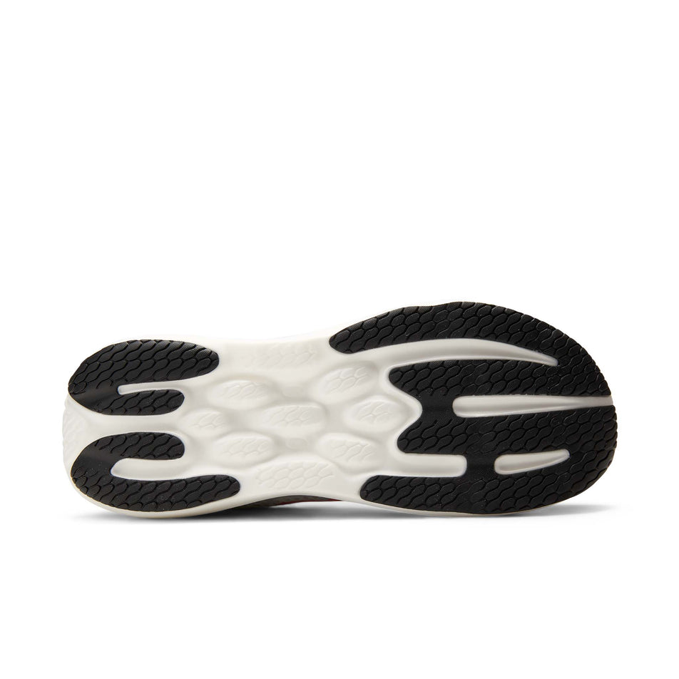 The outsole of the right shoe from a pair of New Balance Men's 1080 V15 Running Shoes in the White/Pink Heat colourway.