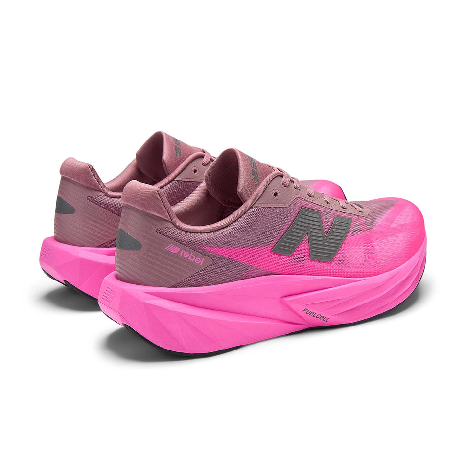 A pair of New Balance Men's Fuelcell Rebel V5 Running Shoes in the Pink Heat/Rosewood colourway.