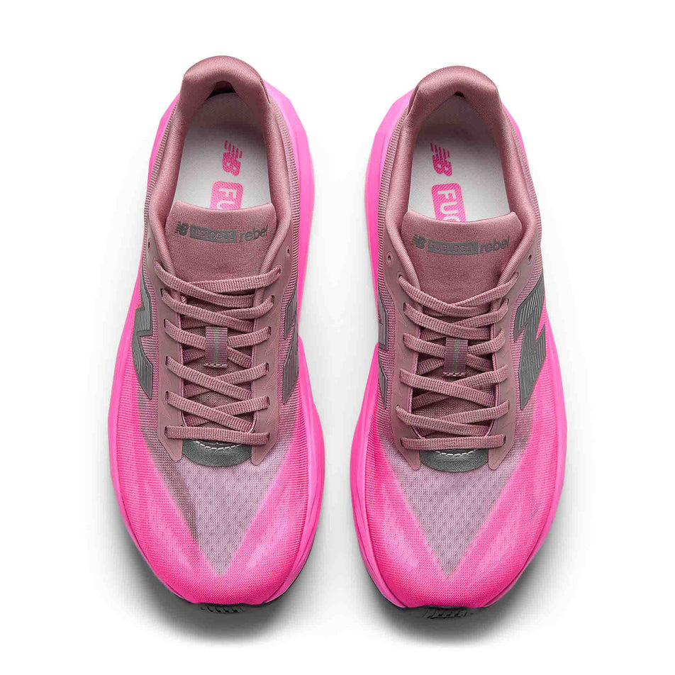 The uppers of a pair of New Balance Men's Fuelcell Rebel V5 Running Shoes in the Pink Heat/Rosewood colourway.