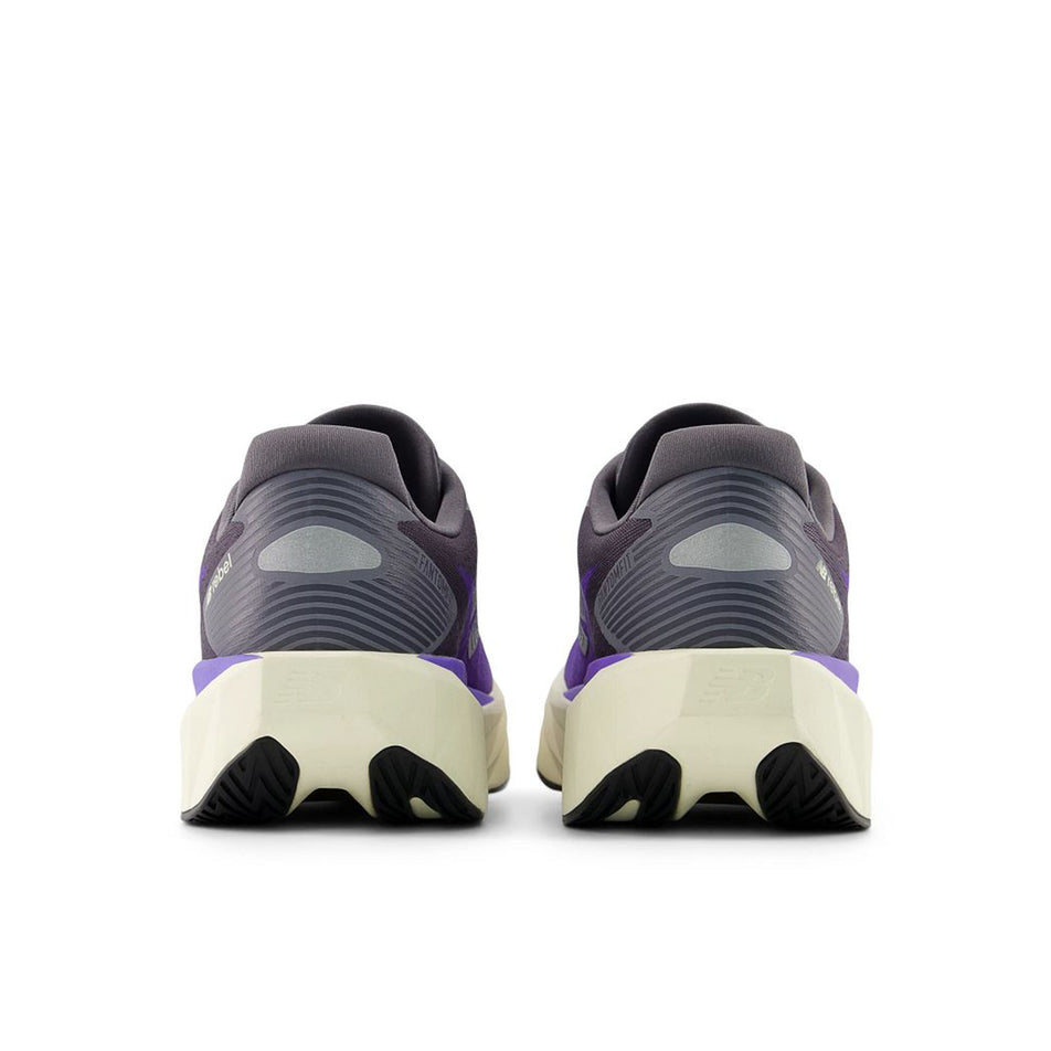 The back of a pair of New Balance Men's Fuelcell Rebel V5 Running Shoes in the Electric Indigo/Truffle Salt colourway.