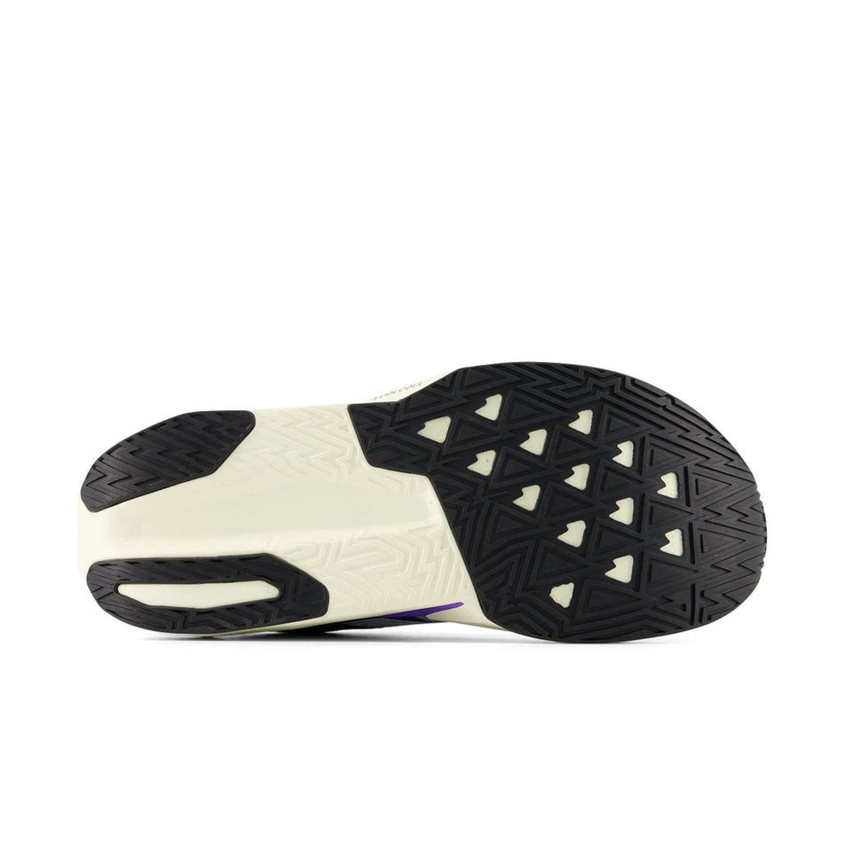 The outsole of the right shoe from a pair of New Balance Men's Fuelcell Rebel V5 Running Shoes in the Electric Indigo/Truffle Salt colourway.