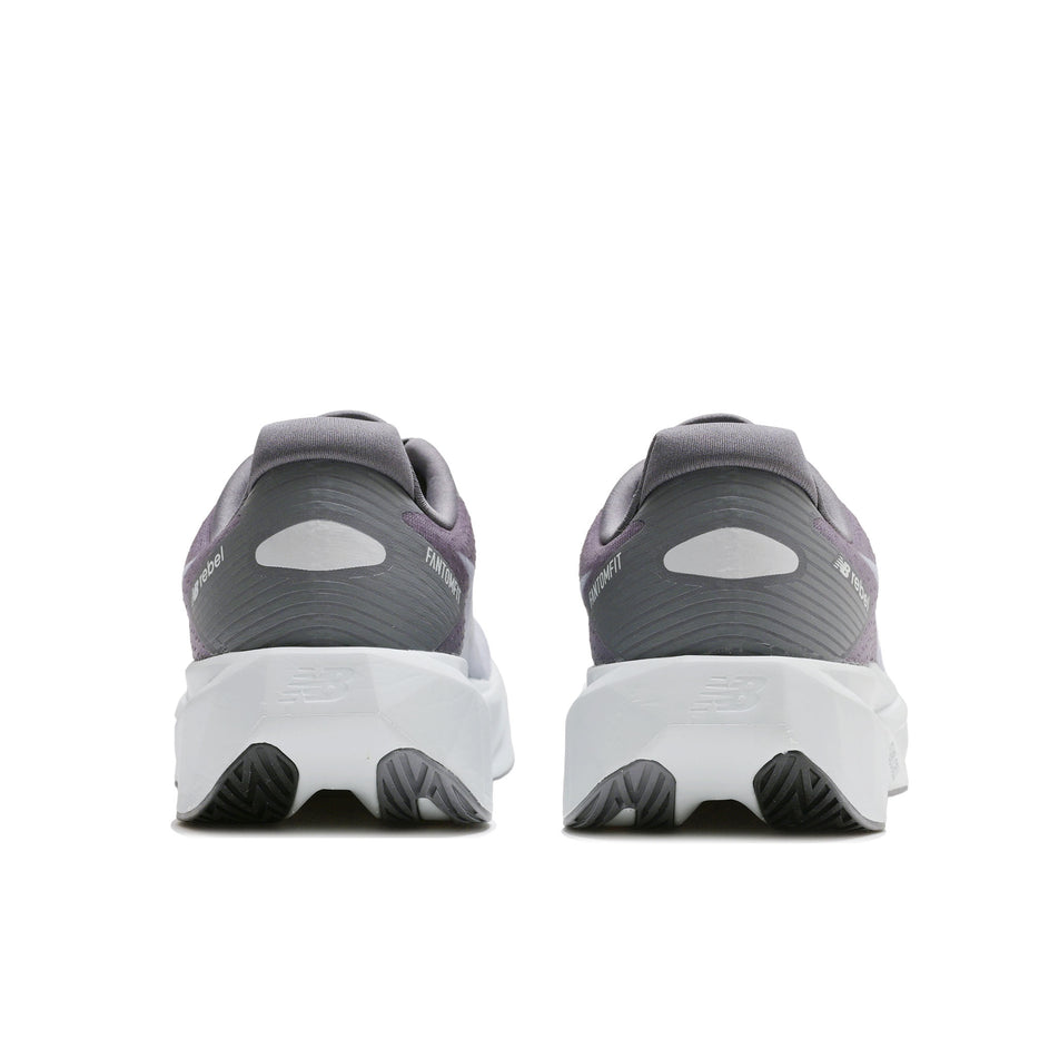 The back of a pair of New Balance Men's Fuelcell Rebel V5 Running Shoes in the Magnet/Light Zinc Blue colourway.