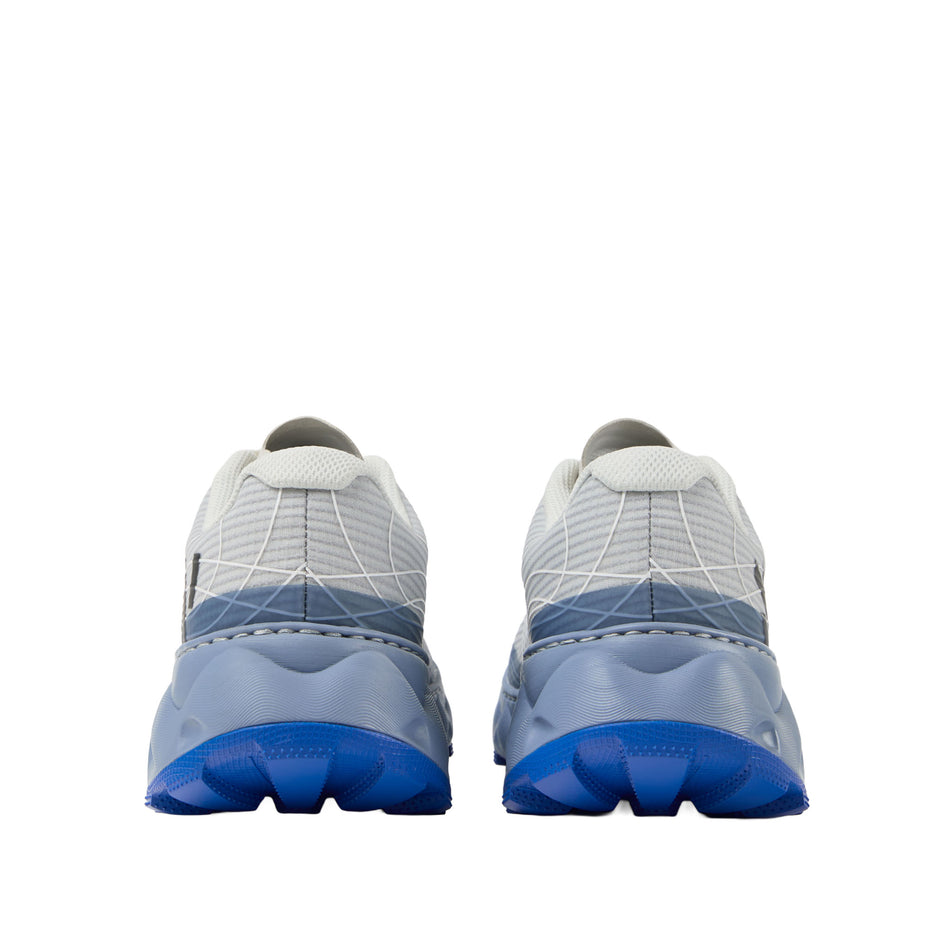 The back of a pair of NNormal Unisex Tomir 2.0 Running Shoes in the Blue colourway. (8742920978594)