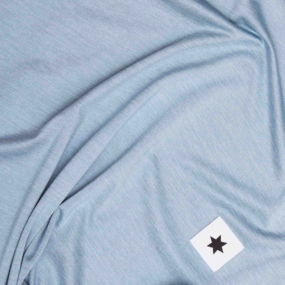 Close-up of the SAYSKY logo on the SAYSKY Men's Logo Pace Long Sleeve in the Blue Melange colourway. (8601261670562)