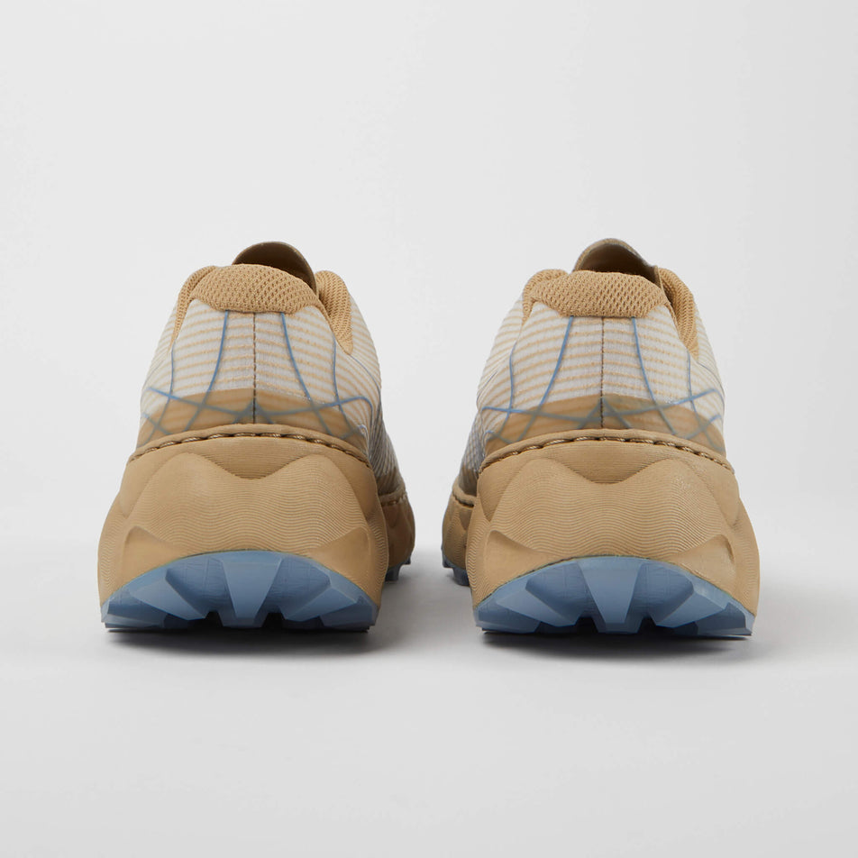 The back of a pair of NNormal Unisex Tomir Trail Running Shoes in the sand/blue colourway (7965429039266)