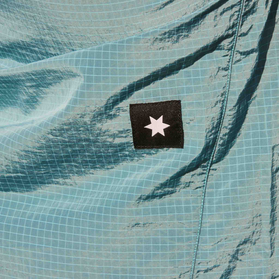 Close-up of the SAYSKY logo on the SAYSKY Women's Clean Pace Shield Jacket in the Blue colourway. (8601993445538)