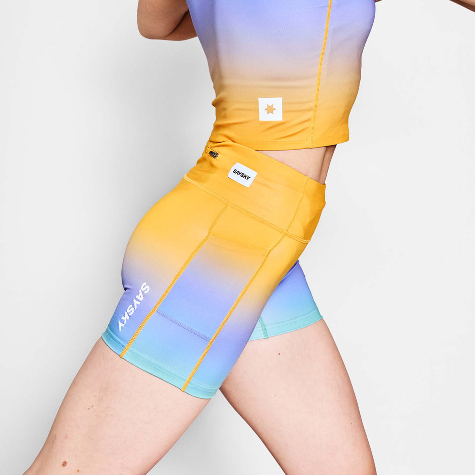 Side view of a model wearing the SAYSKY Women's Drip Dye Combat+ Short Tights 4