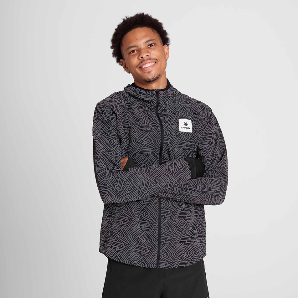 Front view of a model wearing the SAYSKY Men's Reflective Blaze Jacket in the Black colourway. (8787878084770)