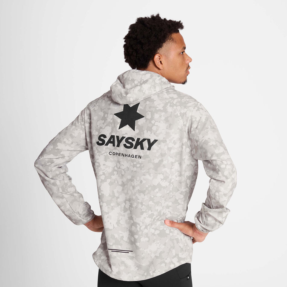 Back view of a model wearing the SAYSKY Men's Camo Pace Jacket in the White colourway. (8781019578530)