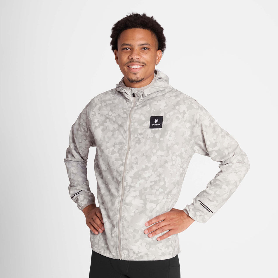 Front view of a model wearing the SAYSKY Men's Camo Pace Jacket in the White colourway. (8781019578530)