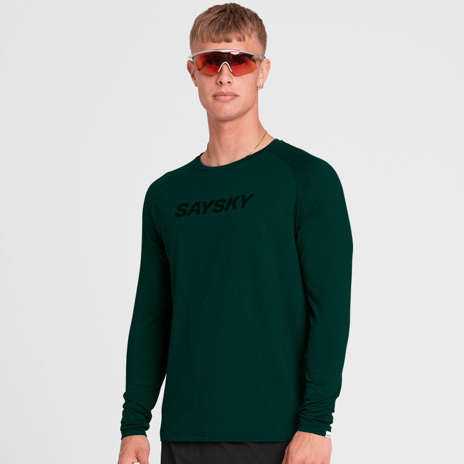 Front view of a model wearing the SAYSKY Men's Logo Pace Long Sleeve in the Green colourway. (8731670249634)