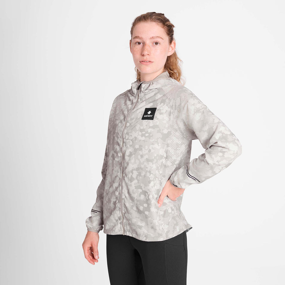 Front view of a model wearing the SAYSKY Women's Camo Pace Jacket in the White colourway. (8781025869986)