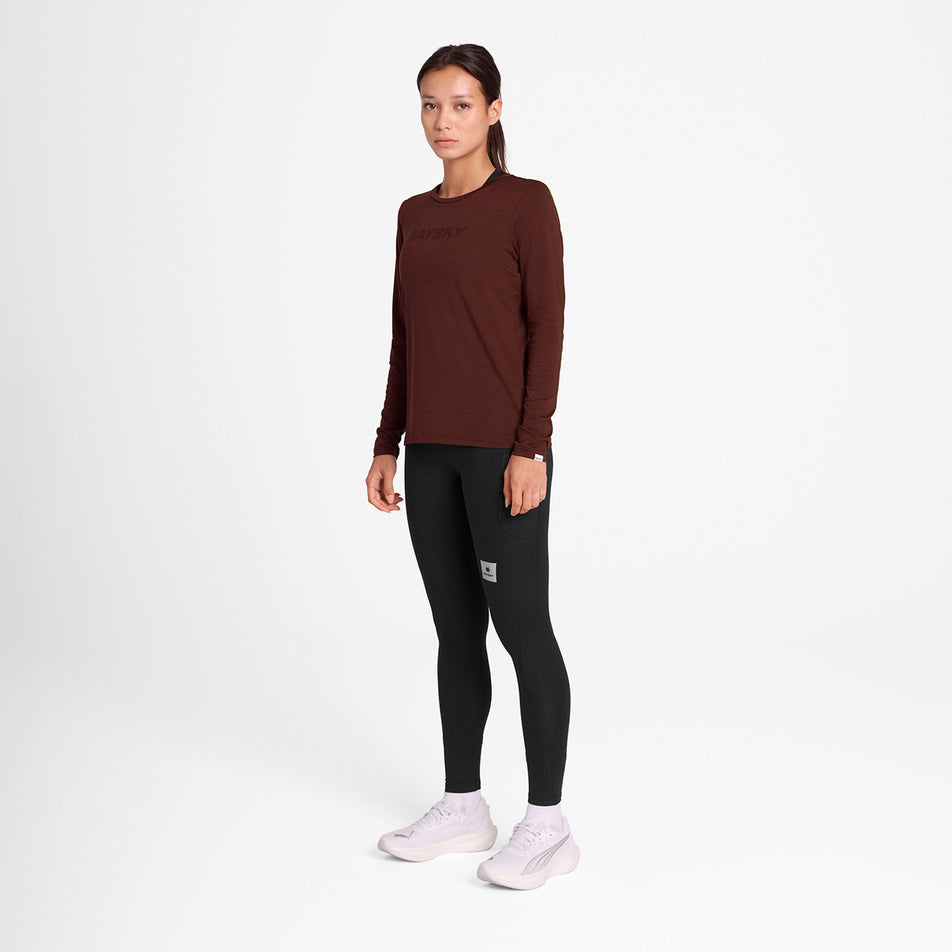 Front view of a model wearing the SAYSKY Women's Logo Pace Long Sleeve in the Red colourway. (8731667792034)