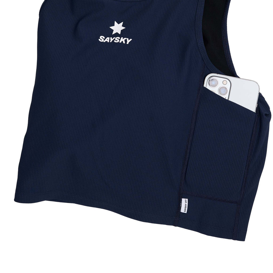Demonstration of the drop-in storage pocket on the SAYSKY Women's Combat Rib Crop Top in the Blue colourway. (8730942242978)