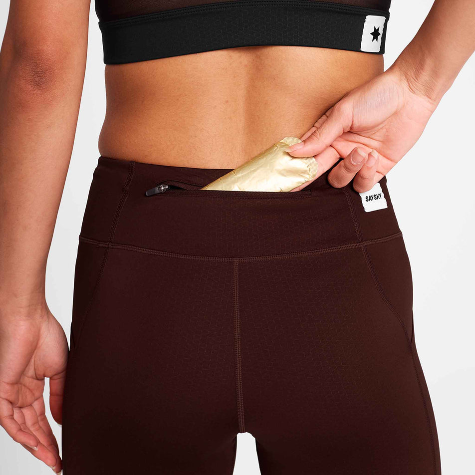 A model demonstrating the zip pocket on the back of the SAYSKY Women's Combat+ Short Tights 7