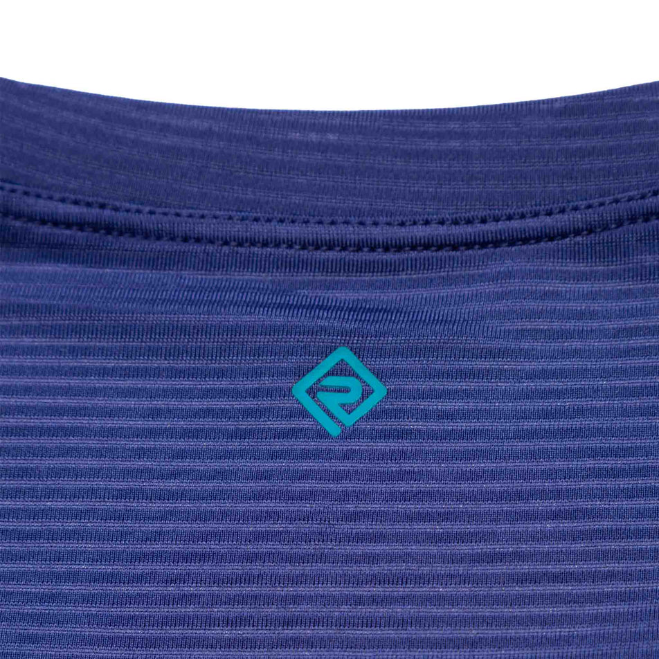 Close-up view of the Ronhill logo on the upper back of the Women's Tech S/S Tee. (8490088464546)
