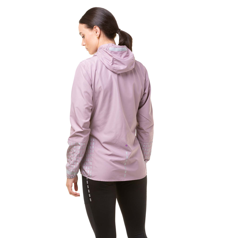 Back view of a model wearing a Ronhill Women's Tech Afterhours Jacket in the Stardust/Thistle/Reflect colourway. (8019199557794)