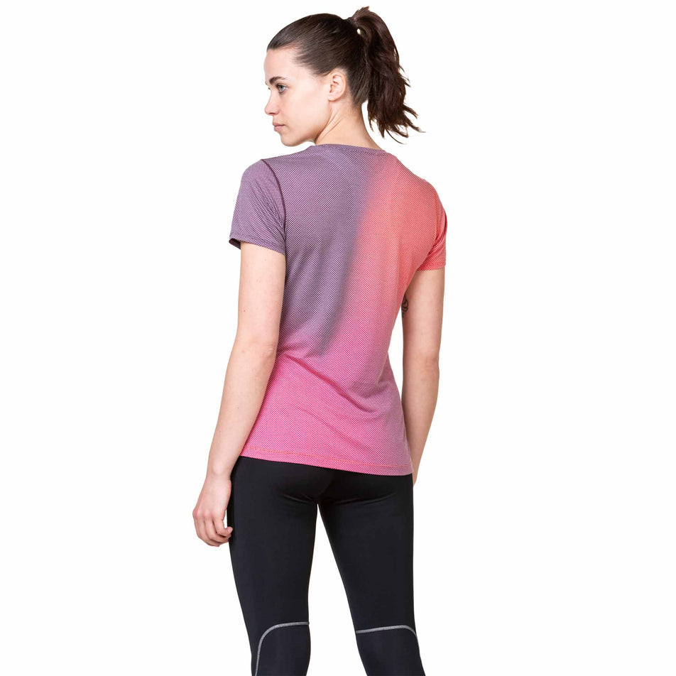 Back view of a model wearing the Ronhill Women's Tech Golden Hour Tee in the Damson/Sunset Merge colourway. (8563589709986)