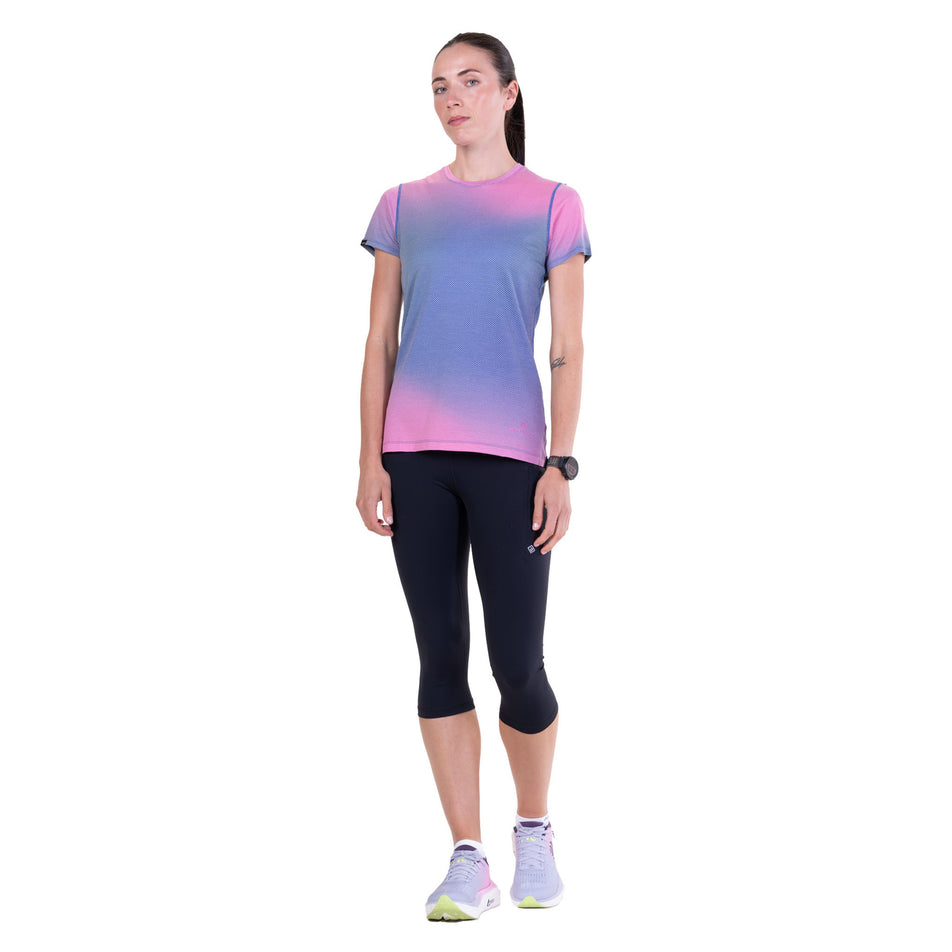 Front view of a model wearing the Ronhill Women's Tech Golden Hour S/S Tee in the Orchid Glow colourway.