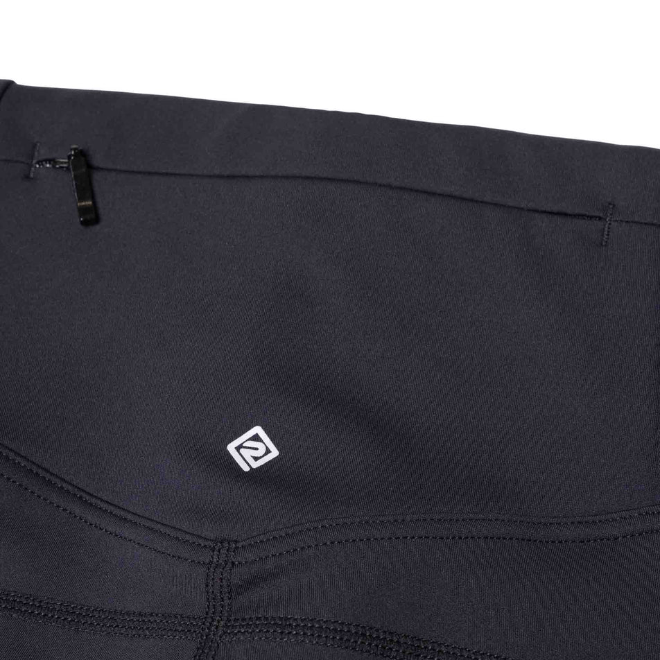 The zip pocket on the back of the Ronhill Women's Tech Capri in the All Black colourway. (8583300677794)