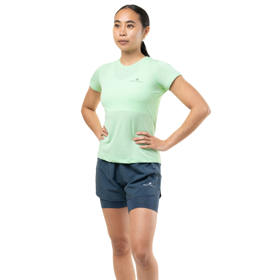 Front view of a model wearing the Ronhill Women's Core Twin Short in the Evening Haze colourway.