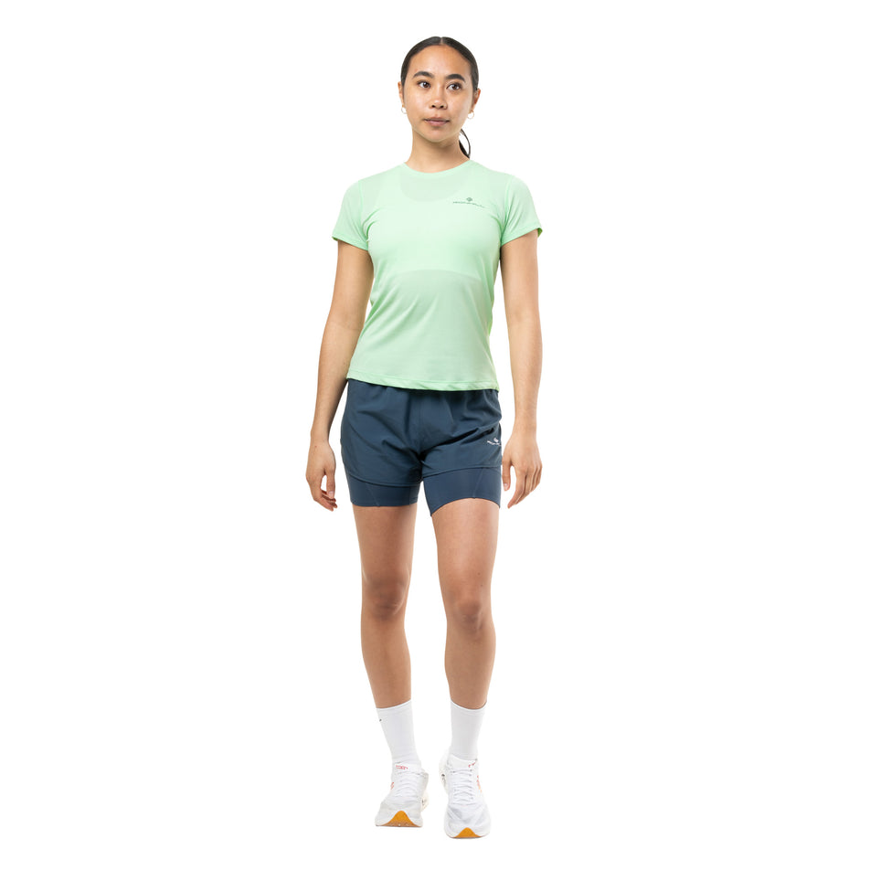 Front view of a model wearing the Ronhill Women's Core Twin Short in the Evening Haze colourway.