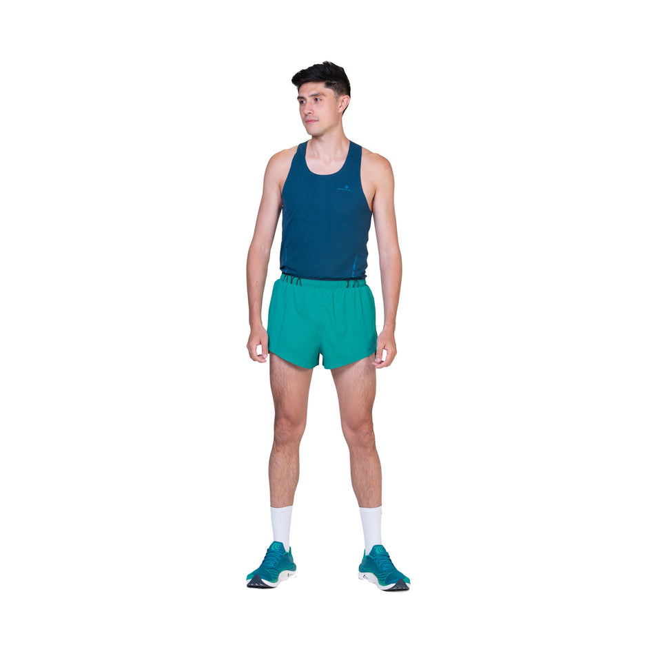 Front view of a model in the Ronhill Men's Tech Race Short in the Deep Laguna/Seafaring colourway. (8563608027298)