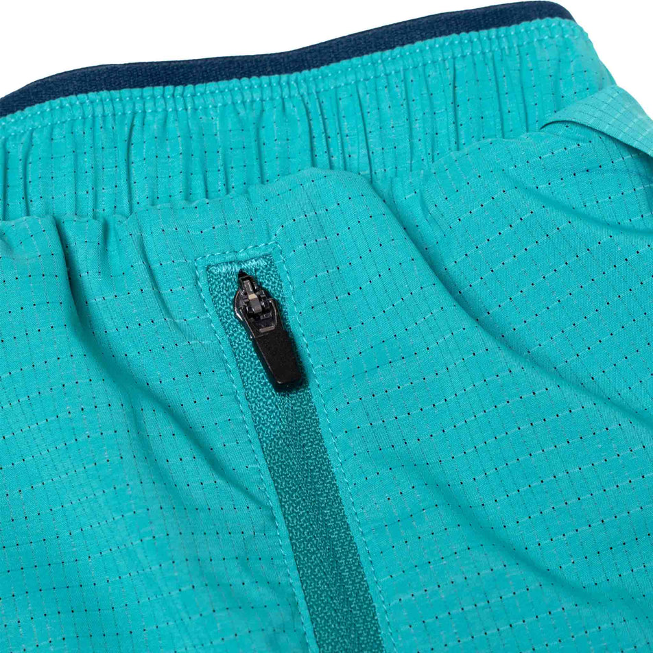 Close-up view of the zip pocket on the Ronhill Men's Tech Race Short in the Deep Laguna/Seafaring colourway. (8563608027298)