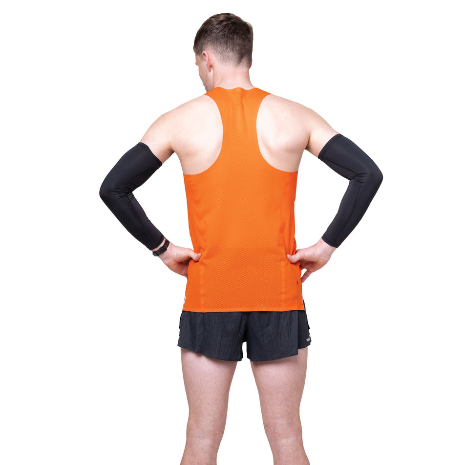Back view of a model wearing the Ronhill Men's Tech Race Vest in the Ronhill Red/Black colourway.