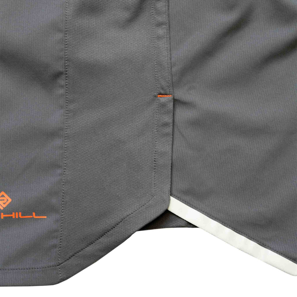 Close-up of the fabric and side split in the fabric at the outer left-leg area of the Ronhill Men's Tech 5
