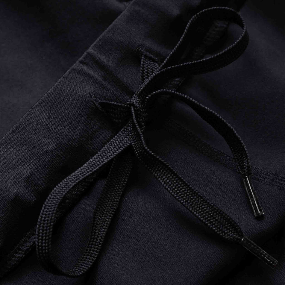 The drawcord on the Ronhill Men's Core Stretch Short in the All Black colourway. (8160894976162)