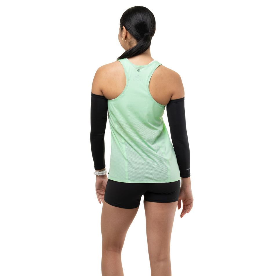 Back view of a model wearing the Ronhill Women's Tech Race Vest in the Seafoam/Laurel colourway.