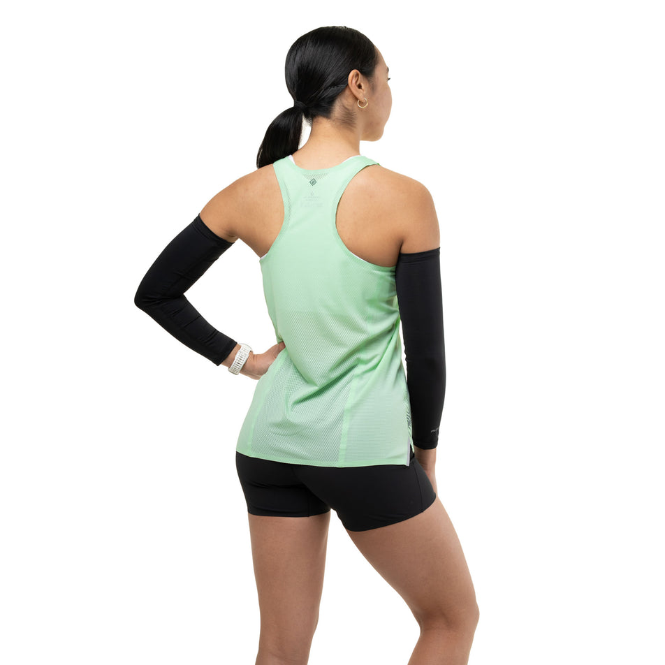 Back view of a model wearing the Ronhill Women's Tech Race Vest in the Seafoam/Laurel colourway.