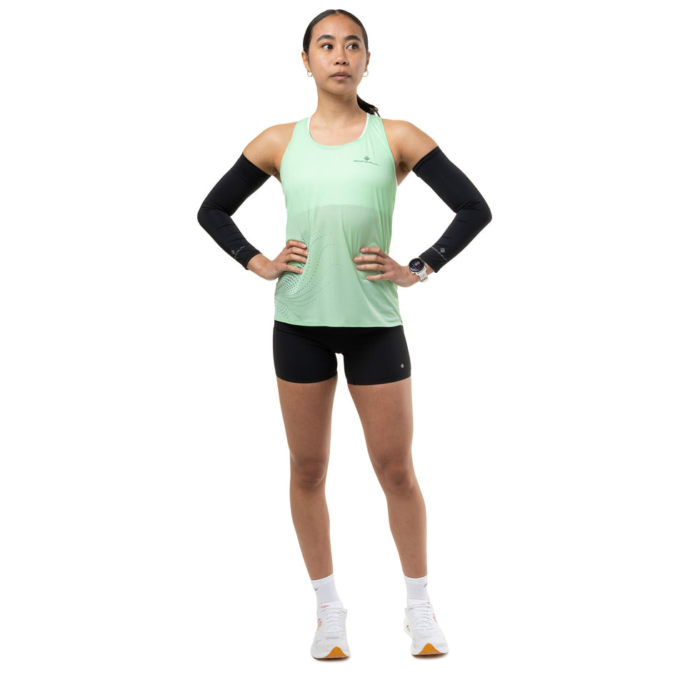 Front view of a model wearing the Ronhill Women's Tech Race Vest in the Seafoam/Laurel colourway.