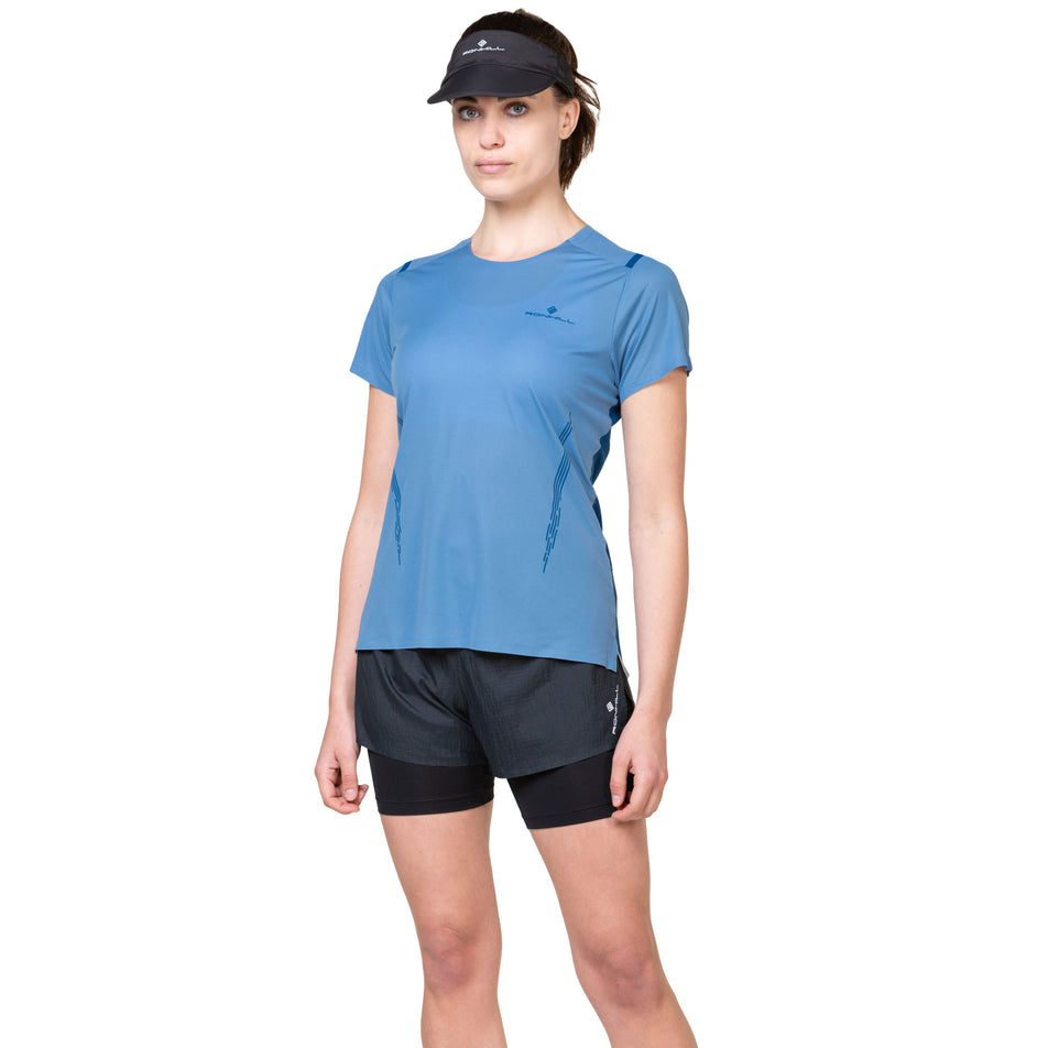 Front view of a model wearing the Ronhill Women's Tech Race S/S Tee in the Island/Tidal colourway. (8564965048482)