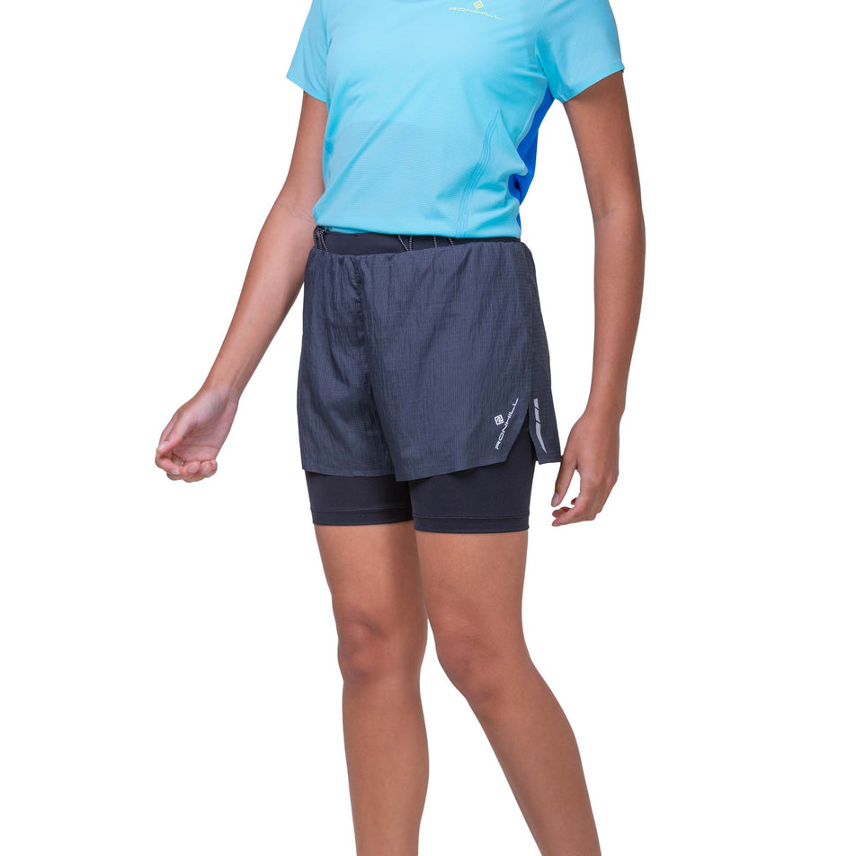 Front view of a model wearing the Ronhill Women's Tech Race Twin Short in the All Black colourway. Model is also wearing a running top. (8158813323426)
