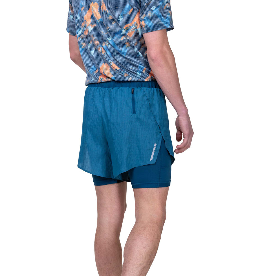 Back view of a model wearing the Ronhill Men's Tech Race Twin Short in the Legion/Fluo Orange colourway. Model is also wearing a Ronhill top. (8160877543586)