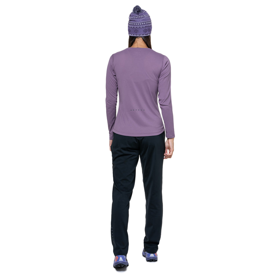 Back view of a model wearing the Ronhill Women's Core L/S Tee in the Dark Iris/Iris colourway. (8742760022178)