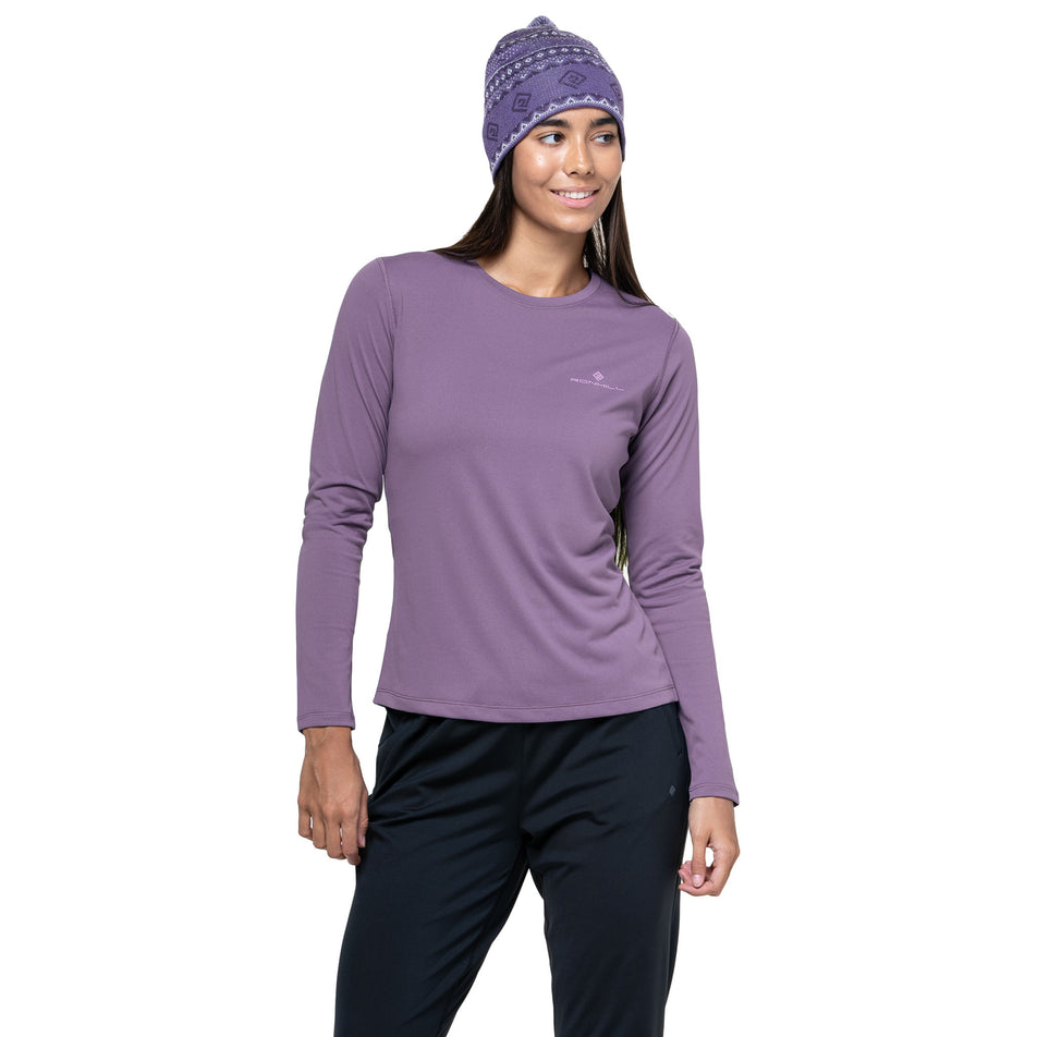 Front view of a model wearing the Ronhill Women's Core L/S Tee in the Dark Iris/Iris colourway. (8742760022178)