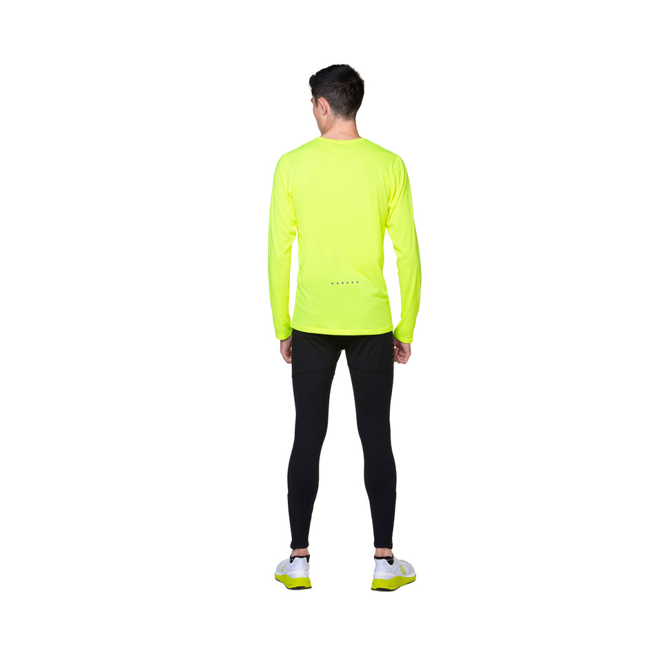 Back view of a model wearing the Ronhill Men's Core L/S Tee in the Fluo Yellow/Black colourway. (8748741525666)