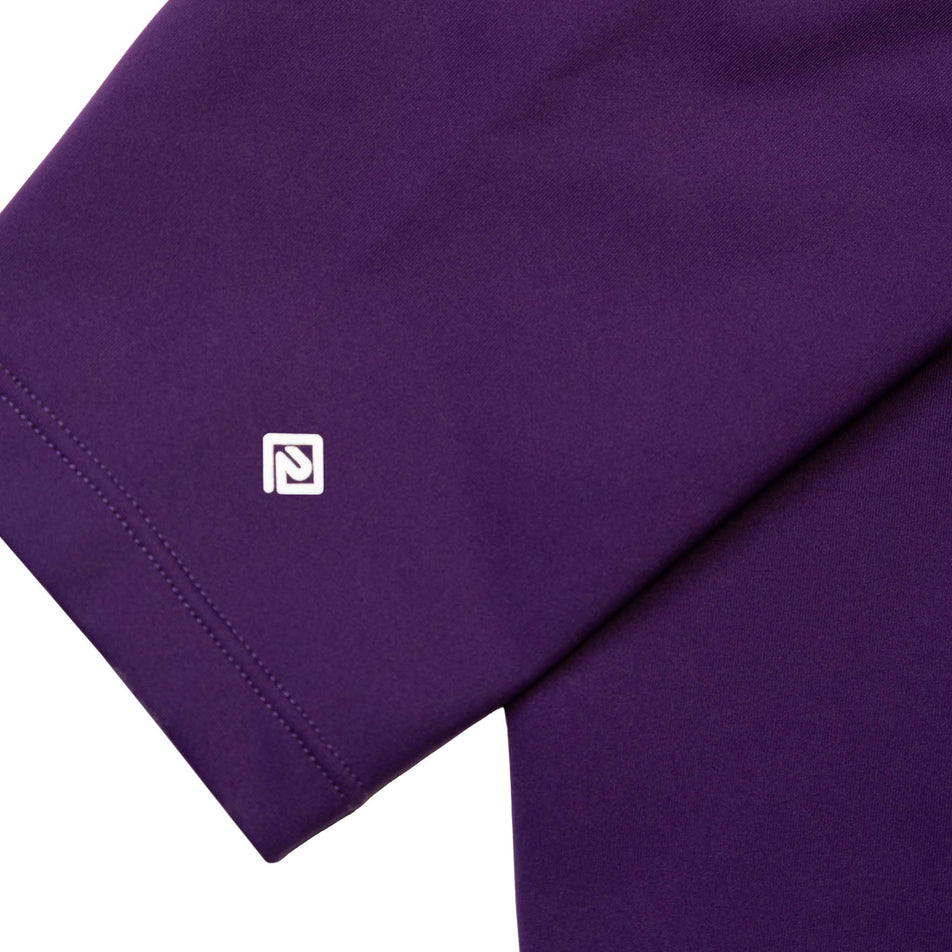 Close-up of the Ronhill logo and fabric at the ankle area of the Ronhill Women's Tech Tight. (8489979510946)