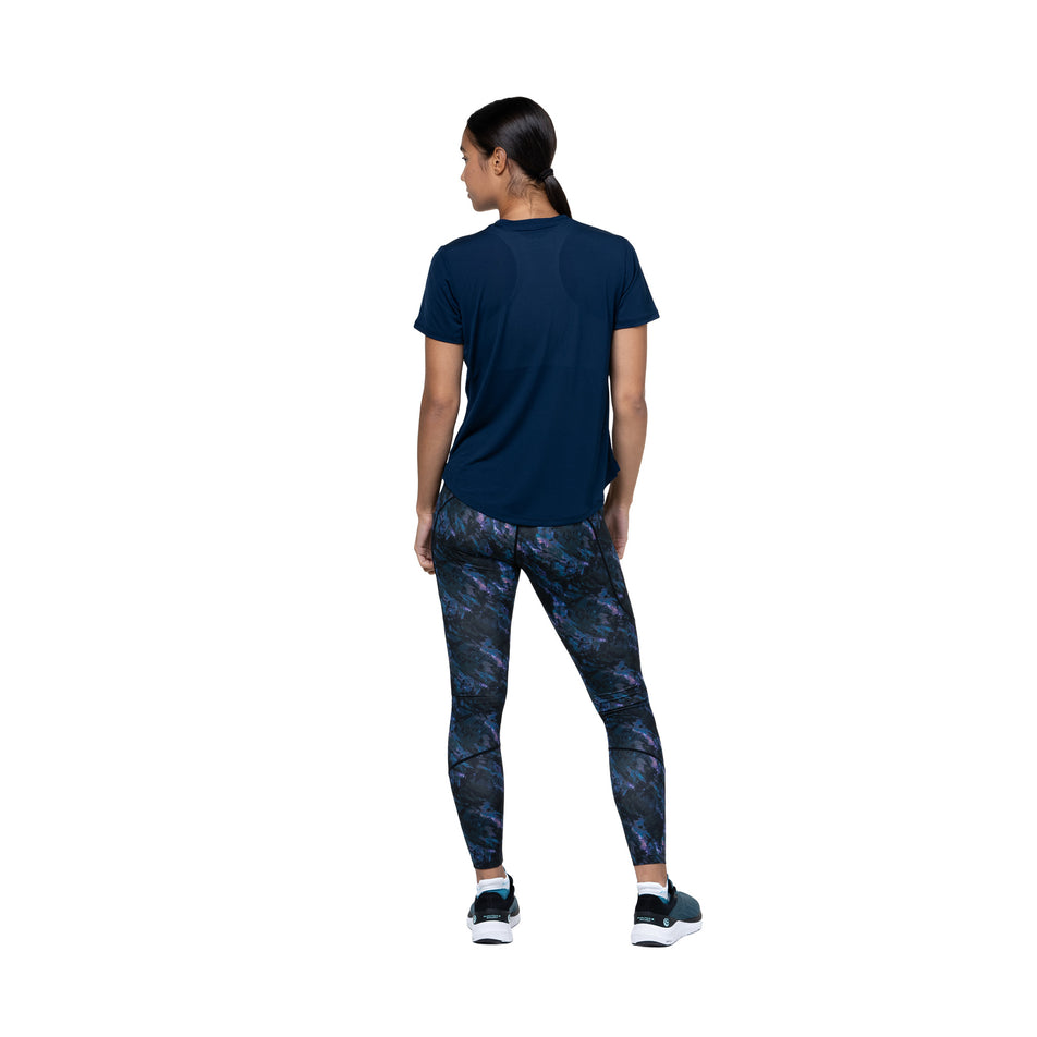 Back view of a model wearing the Ronhill Women's Tech Tight in the Cosmic colourway. (8747579211938)