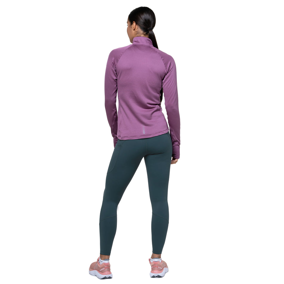 Back view of a model wearing the Ronhill Women's Tech Tight in the Evening Haze colourway. (8742711853218)
