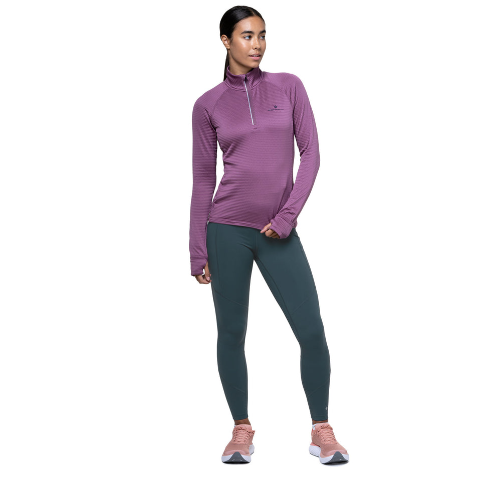 Front view of a model wearing the Ronhill Women's Tech Tight in the Evening Haze colourway. (8742711853218)