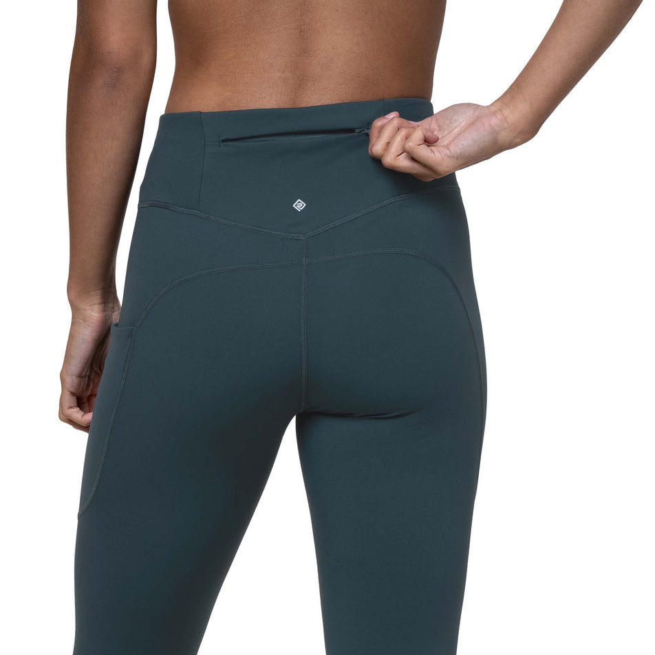 The zippered pocket on the back of the Ronhill Women's Tech Tight in the Evening Haze colourway. (8742711853218)
