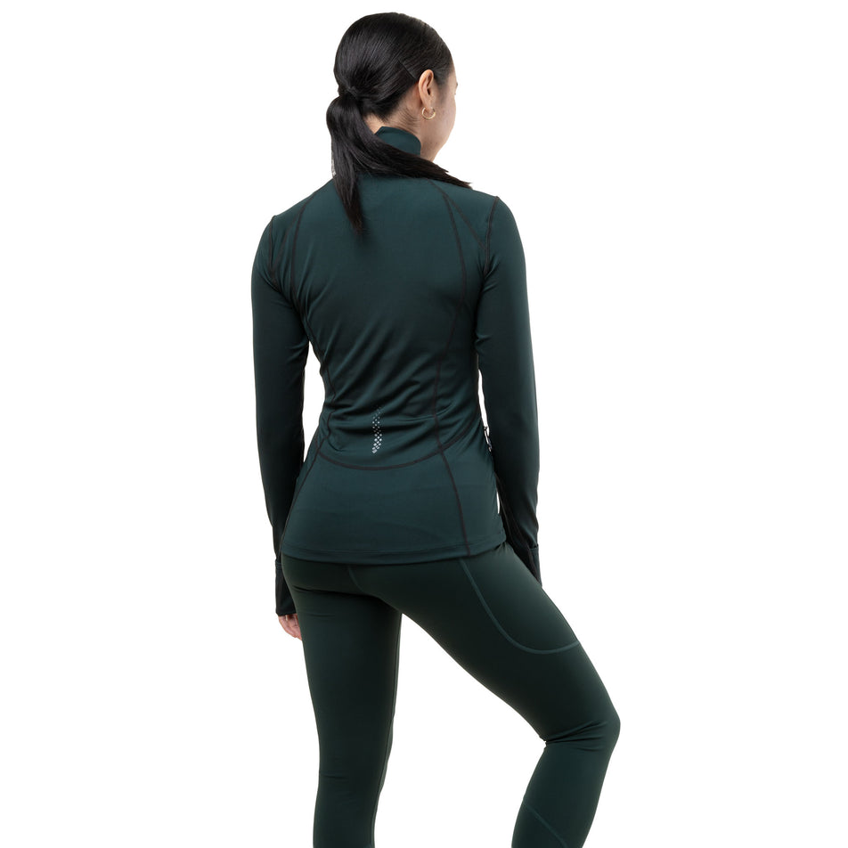 Back view of a model wearing the Ronhill Women's Tech Tight in the Dark Laurel colourway.