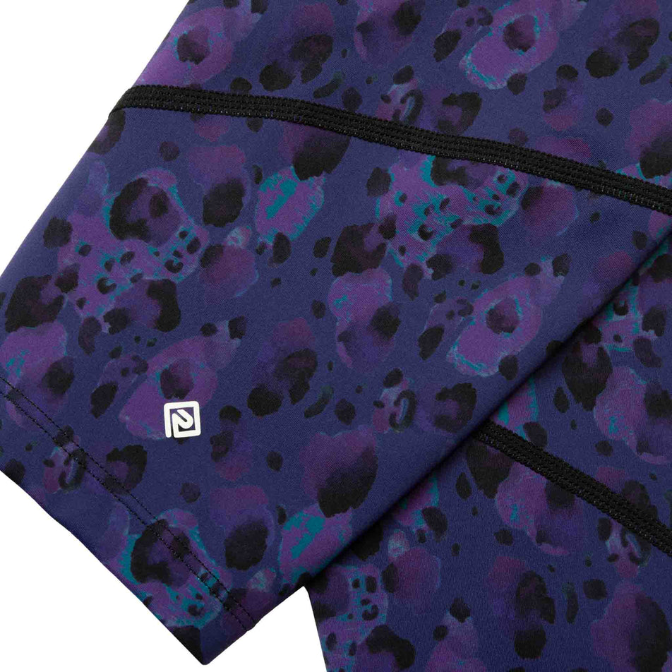 Close-up of the Ronhill logo and fabric on the lower leg of the Ronhill Women's Tech Crop Tight. (8490052518050)