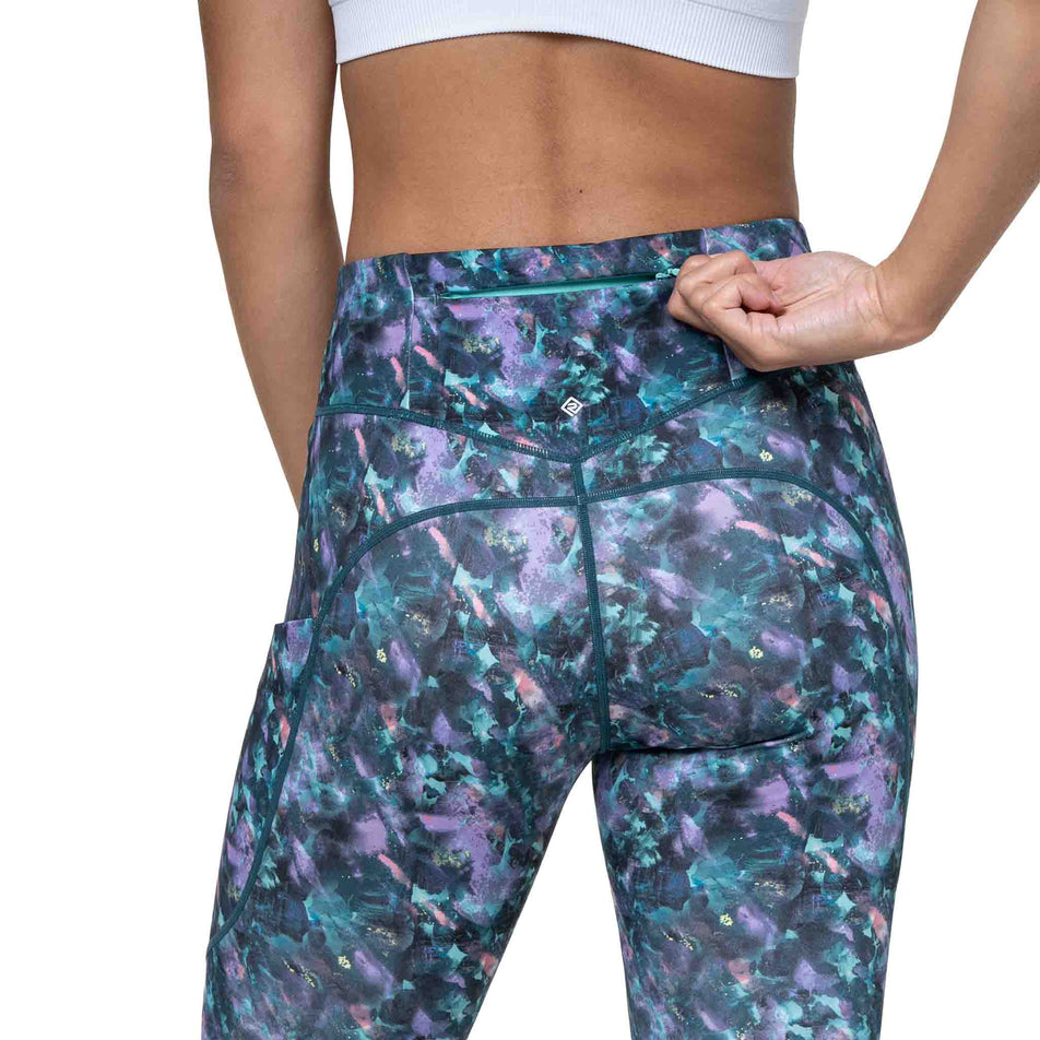 The zip pocket on the back of the Ronhill Women's Tech Crop Tight in the Multi Flora colourway. (8747609784482)