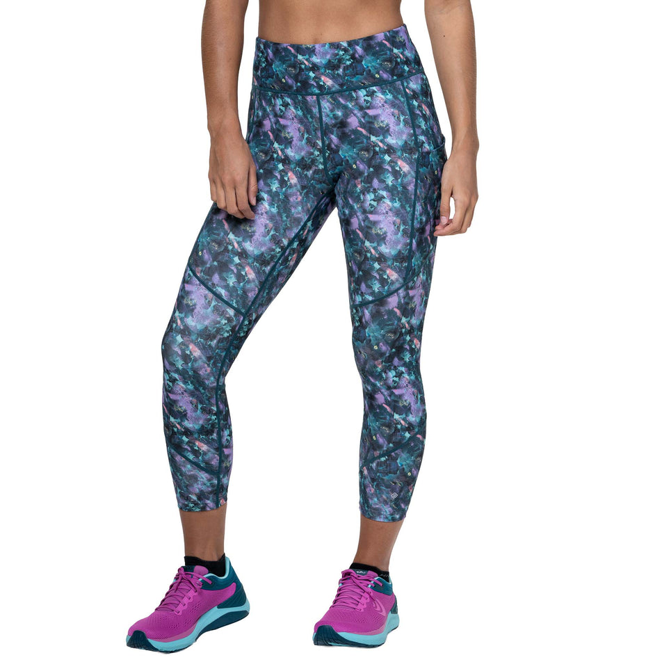 Front view of a model wearing the Ronhill Women's Tech Crop Tight in the Multi Flora colourway. (8747609784482)