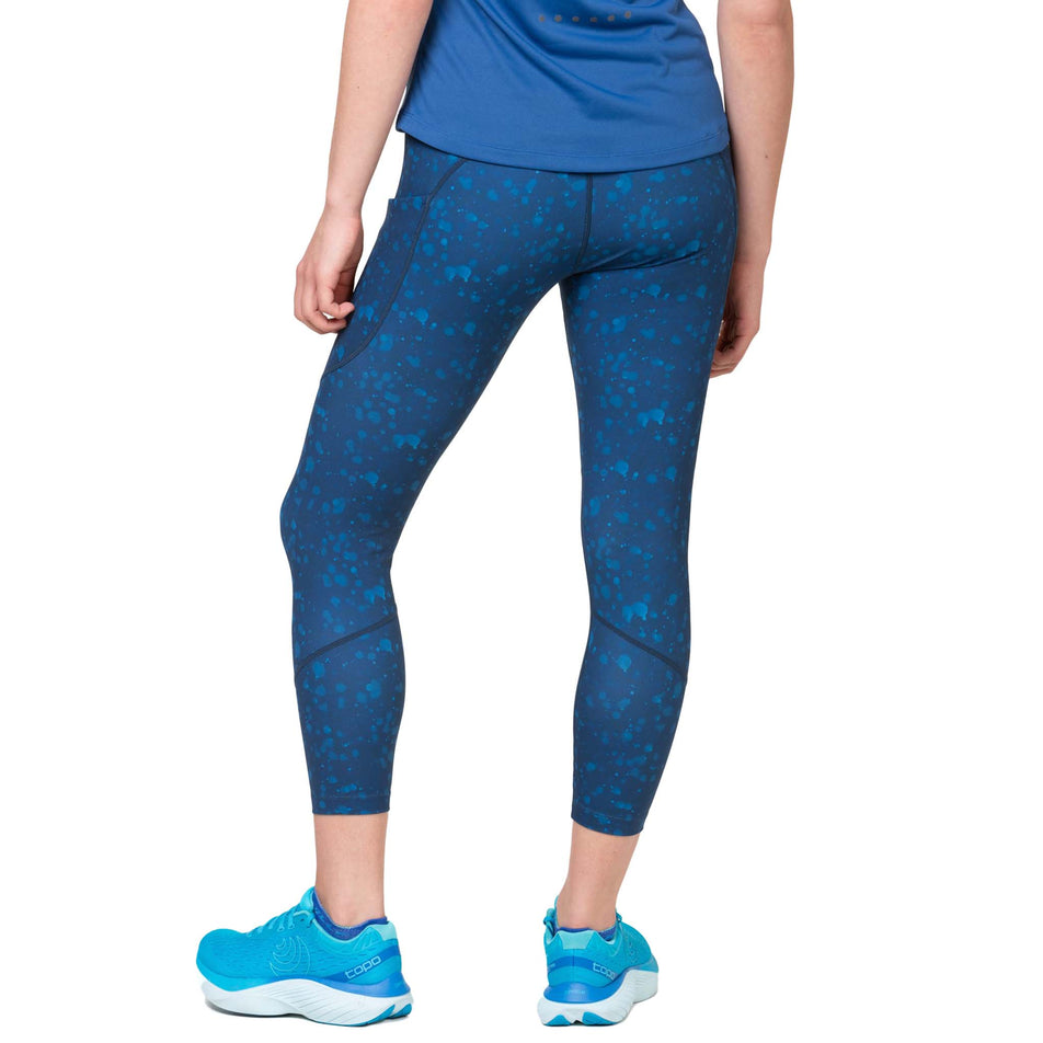 Back view of a model wearing the Ronhill Women's Tech Crop Tight in the Tidal Raindrops colourway. (8564970619042)
